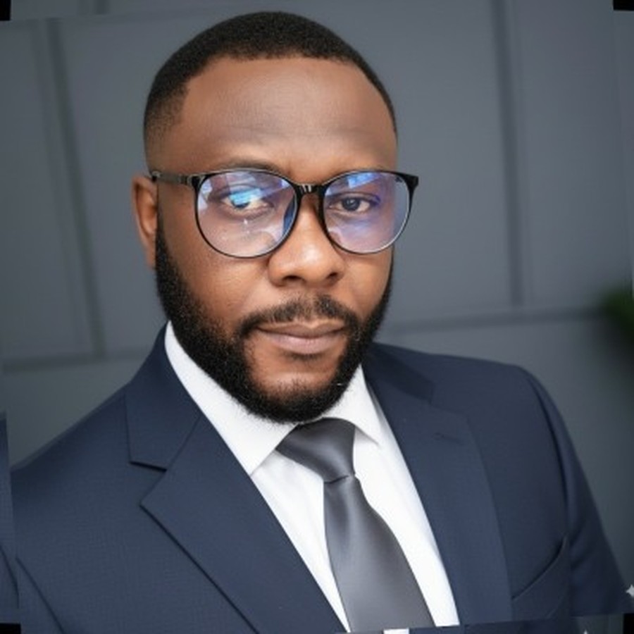 Professional headshot of Alexander Adegbe